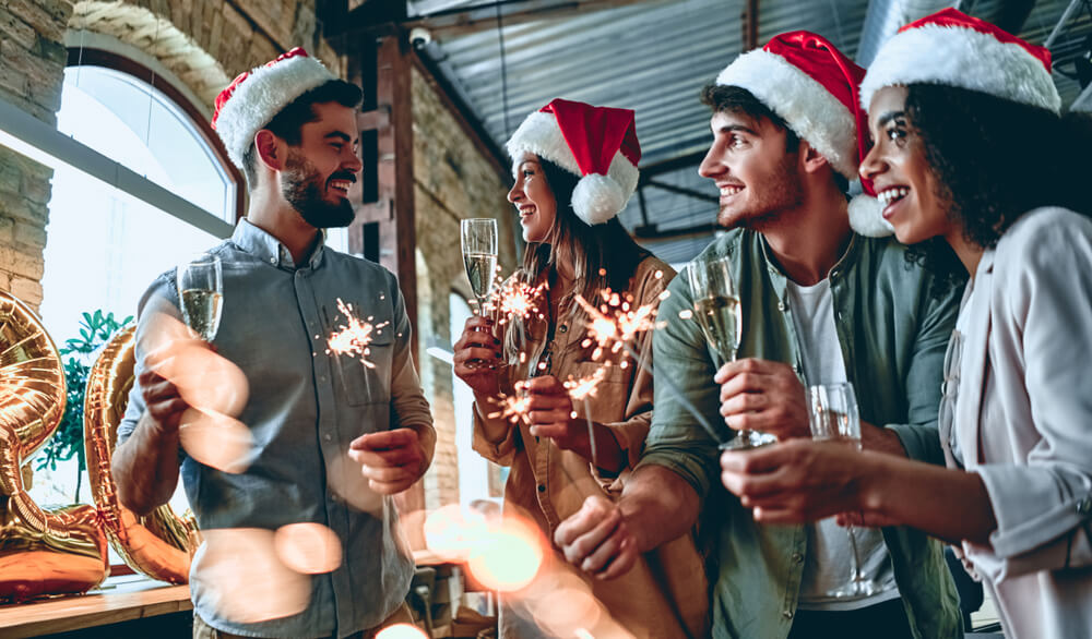 Multiracial Young Creative People Are Celebrating Holiday In Modern Office.