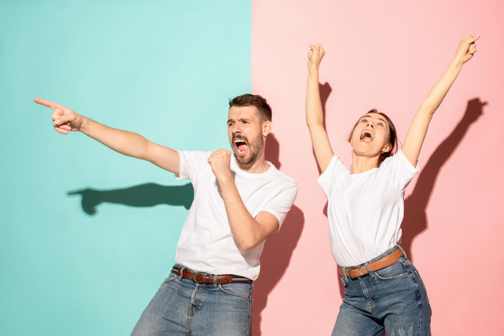 A couple dancing and singing together.