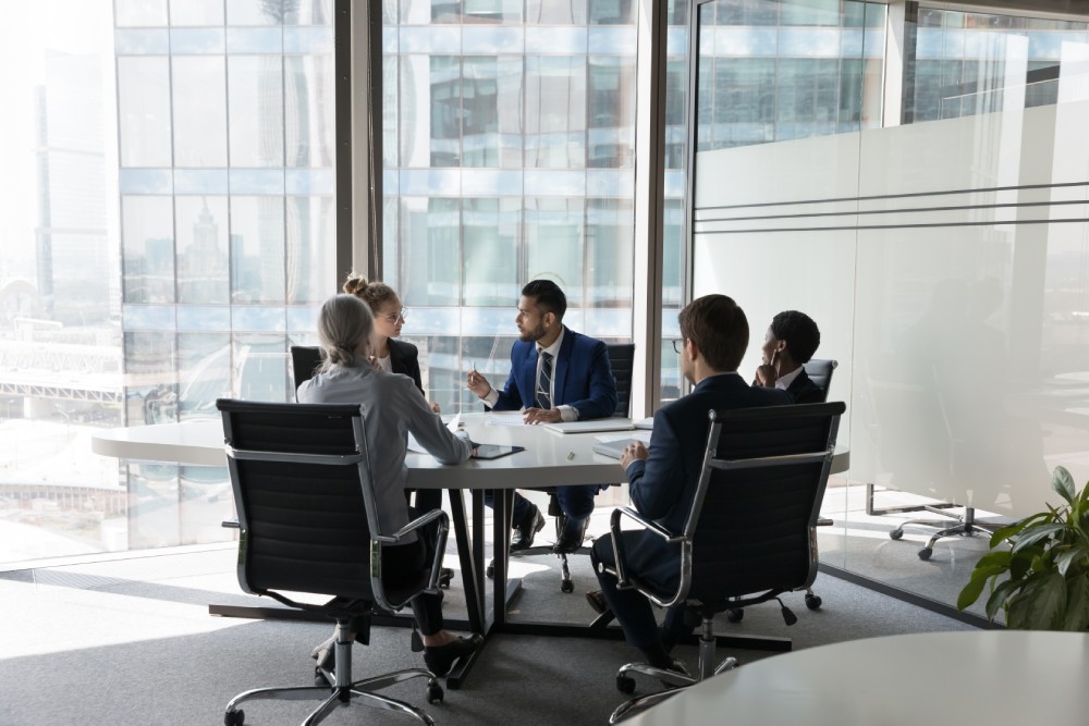 Serious,Team,Of,Professionals,,Five,Multi,Ethnic,Business,People,Negotiating
