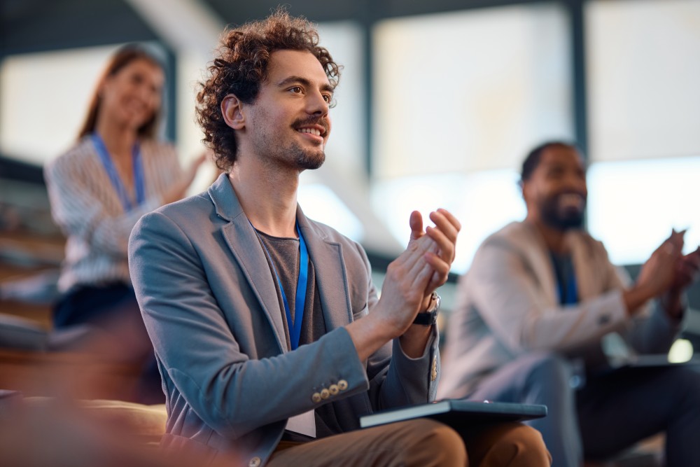 Happy,Businessman,And,His,Colleagues,Applauding,While,Attending,An,Education